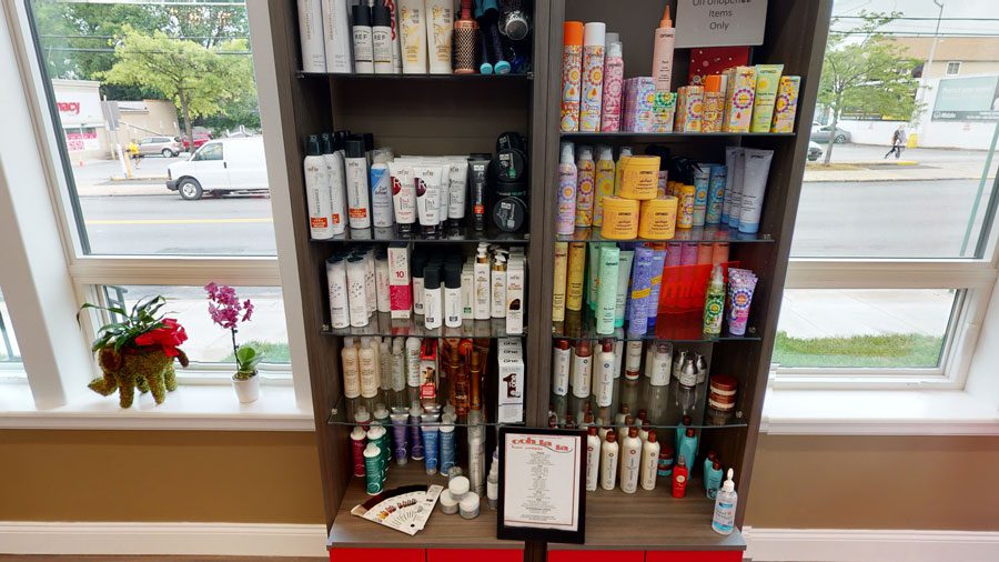 professional hair care products on shelf at Ooh La La
